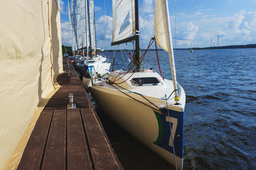 Fototapeta premium Sailing regatta. Summer vacation on the beach.