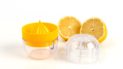 Plastic yellow press for lemon. device for lemon juice isolated on white background.