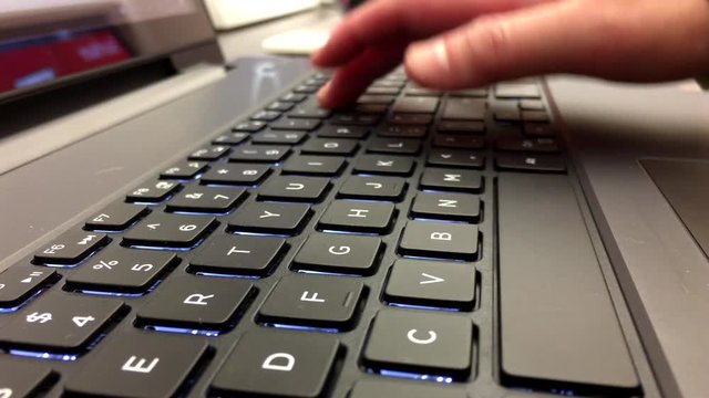 Macro of woman playing new computer at Microsoft store