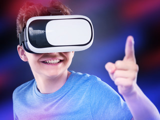 Teen boy in VR glasses