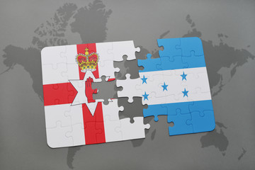 puzzle with the national flag of northern ireland and honduras on a world map