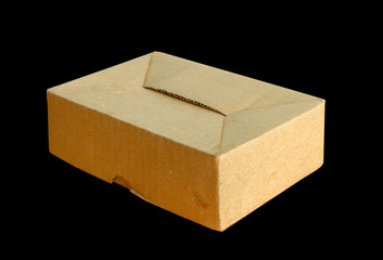 Brown paper box isolated on black background