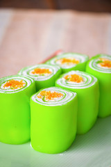 Close up green roll cake on plate