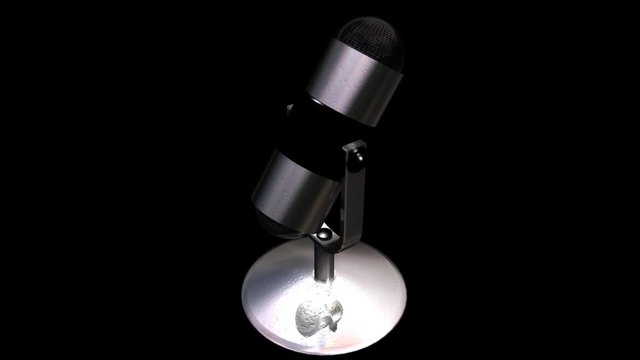 3D studio microphone rotating on a seamless display with alpha channel