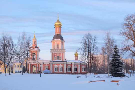 Old orthodox church on a cold winter evening at sunset. Trinity Church in Moscow in the manor Sviblovo