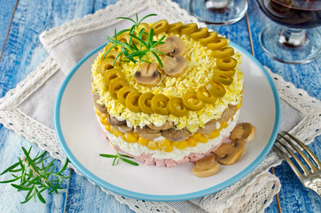 Layered salad with ham, mushrooms and corn