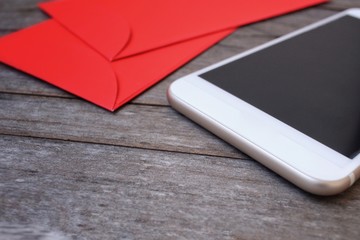 Red envelope in chinese new year festival with smart phone