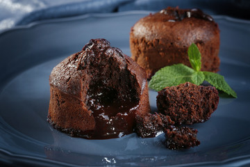 Chocolate fondant with mint on plate