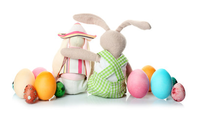 Easter bunnies with eggs on white background