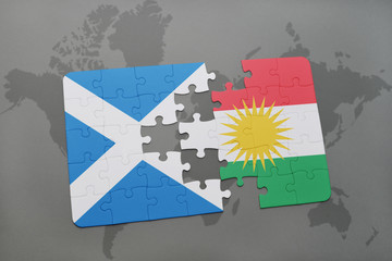 puzzle with the national flag of scotland and kurdistan on a world map