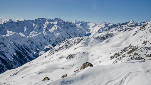 Sunny Winter Day in Snowy Alps Mountain in Solden Valley Time Lapse. Dolly Shot over Snowdrift
