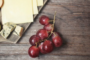 Cheese various and grapes
