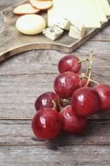 Cheese various and grapes