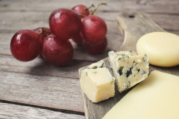 Cheese various and grapes