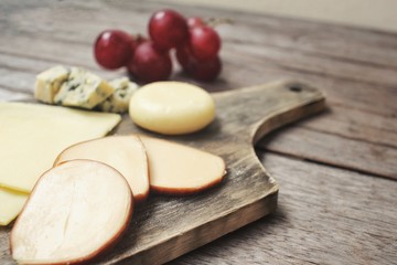 Cheese various and grapes