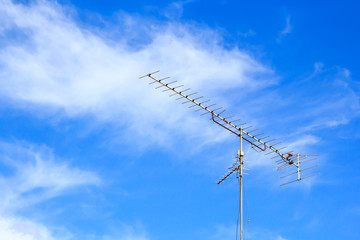 Old antenna with blue sky background