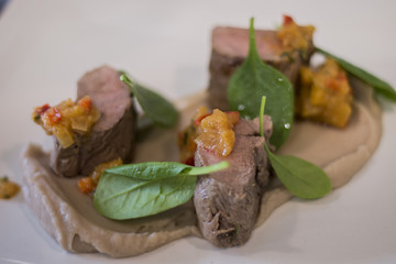 Gourmet dish with lamb and spinach