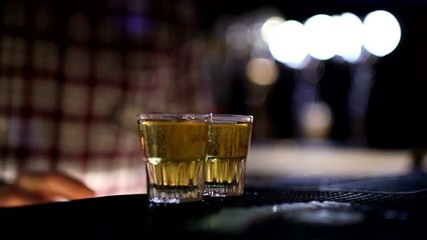 Bartender pours energy in shots