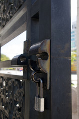 closeup of old lock on metal door