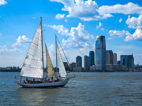 City and a Sail Boat