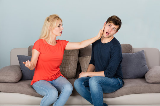 Woman Slapping Man While Quarreling At Home