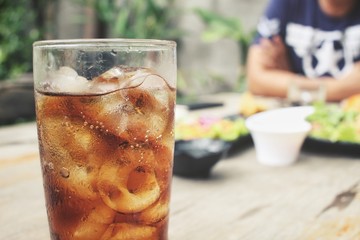 Cola with ice cubes