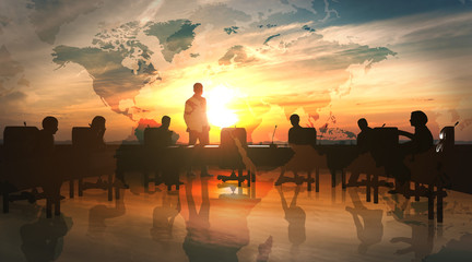 World Management Team in office silhouette