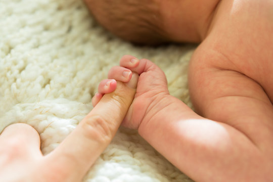 Baby Holding Parent's Finger