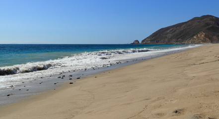 Looking northwest along the shore at Thornhill Broome Beach, Malibu, California.
