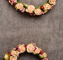 a wreath of flowers on textile background