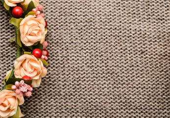 a wreath of flowers on textile background