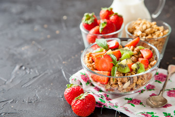 muesli with fruit in a bowl on a table, selective focus, copy space
