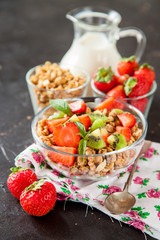 muesli with fruit in a bowl on a table, selective focus, copy space