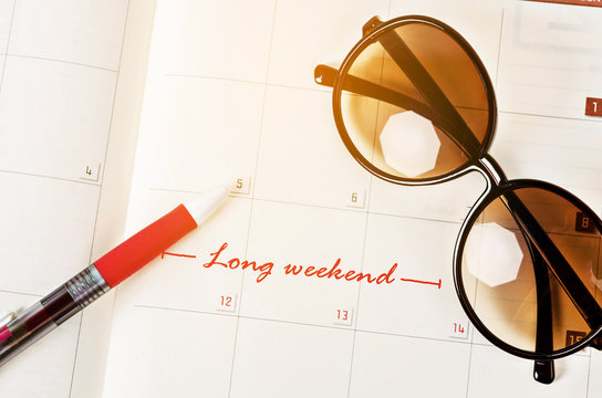 The words Long Weekend on calendar