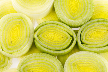 background of sliced leek rings , close up