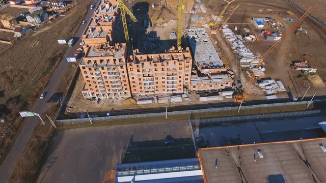 Construction site with a bird's eye. Shooting with drone. Building in the field.