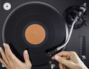 DJ Turntable, Hands Placing Tonearm and Start Playing Vinyl Record, Top View