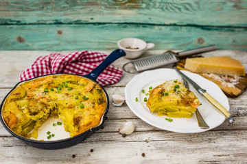Frittata with potatoes and smoked salmon. Tasty Italian food.
