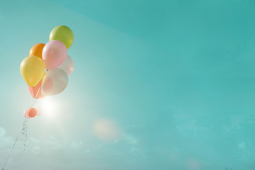 Obraz na płótnie Canvas Happy birthday Concept. multicolor balloons with a retro filter effect,