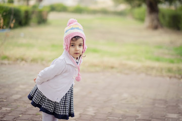 Girl Baby playing outdoor during winter season