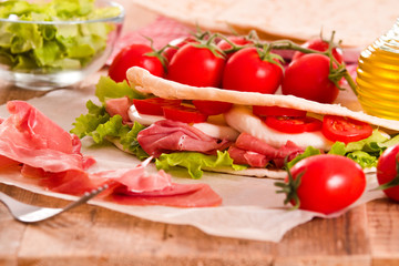 Piadina with ham and lettuce. 