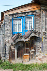 Strange rickety wooden house. Russian province. Summer