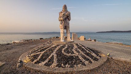 Mordogan, Turkey - May 16, 2015: Fisherman statue in Mordogan, Izmir