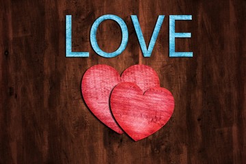 Dark Brown wood texture background with wooden hearts, Text Love on wood