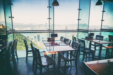 Restaurant with views of the big city with skyscrapers. Hong Kon