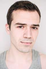Obraz premium Close up portrait of a handsome young man on white