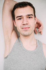 Fototapeta premium Close up portrait of a handsome young man on white