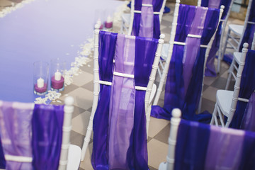 Wedding arch of purple color on the background of the sea.