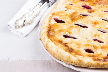 Homemade Cherry Pie with silverware