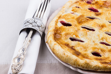 Homemade Cherry Pie with silverware
